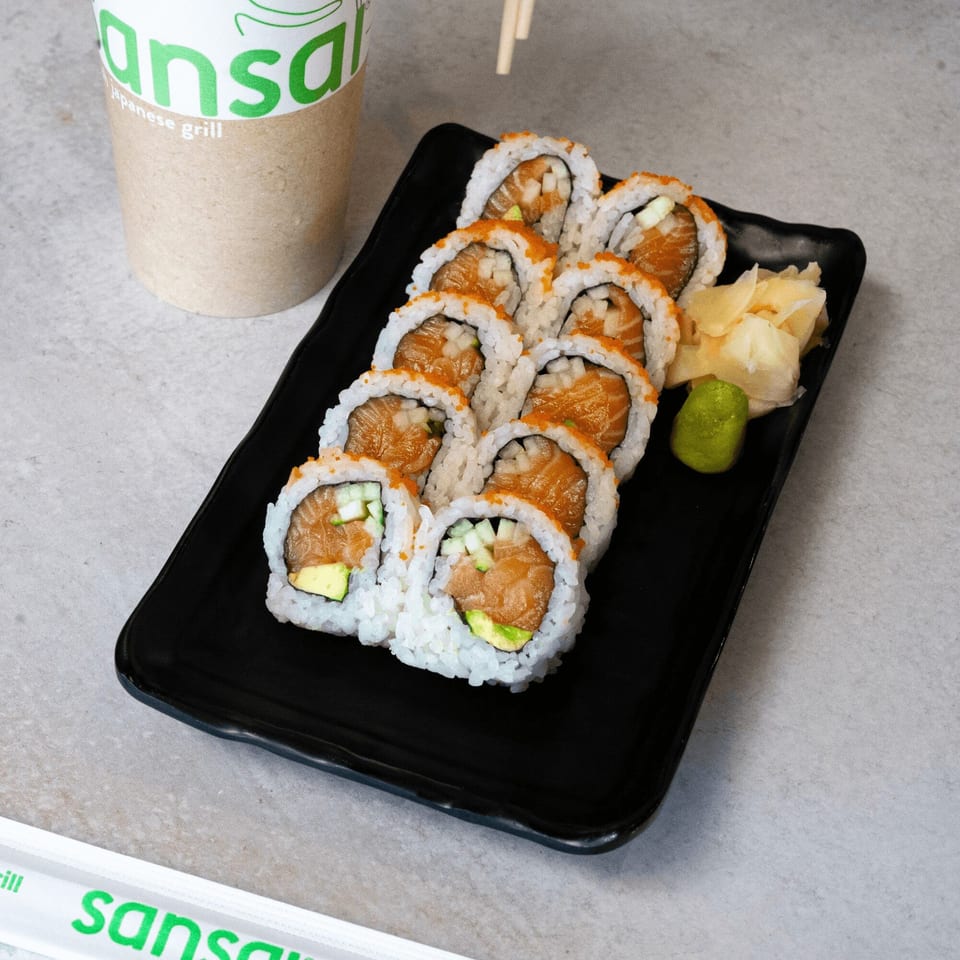 SanSai Japanese Grill sushi rolls with salmon, avocado, and cucumber, served with ginger and wasabi.